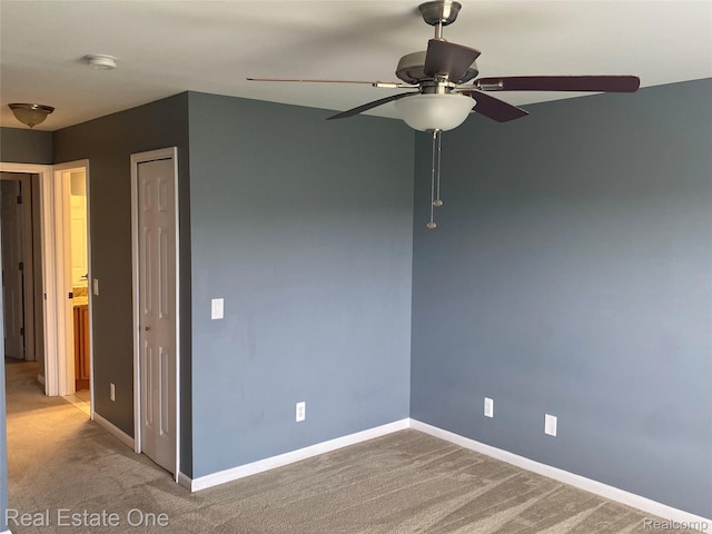 29337 Woodpark Cir Unit 60, Warren, MI 48092 - empty room with a smoke detector, carpet floors, and a ceiling fan