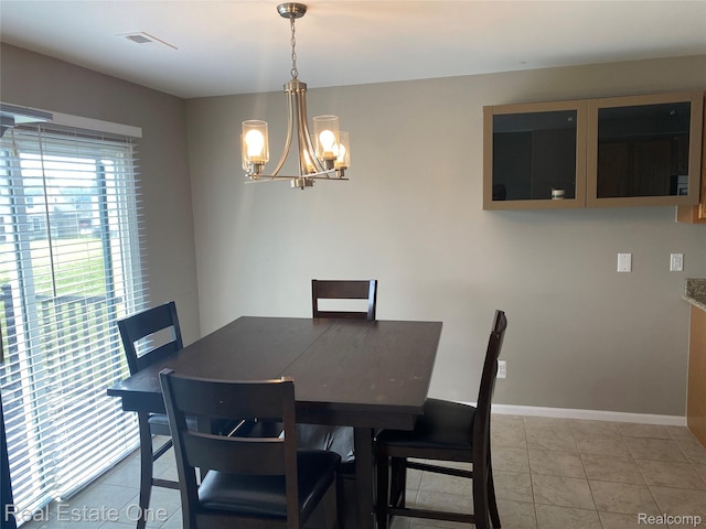 29337 Woodpark Cir Unit 60, Warren, MI 48092 - dining room featuring a chandelier and light tile patterned flooring