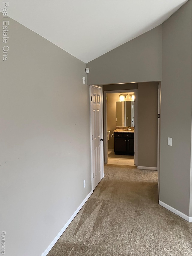 29337 Woodpark Cir Unit 60, Warren, MI 48092 - hall with lofted ceiling and light carpet