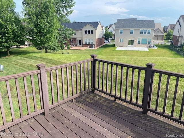29337 Woodpark Cir Unit 60, Warren, MI 48092 - wooden deck featuring a residential view, a patio area, and a yard