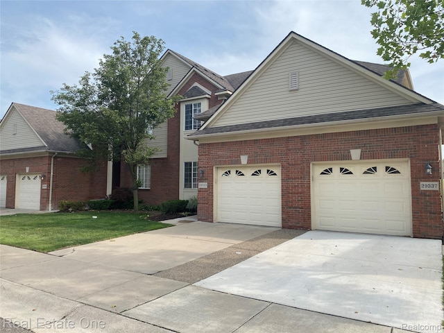 29337 Woodpark Cir Unit 60, Warren, MI 48092 - traditional-style home featuring driveway, brick siding, and a front lawn