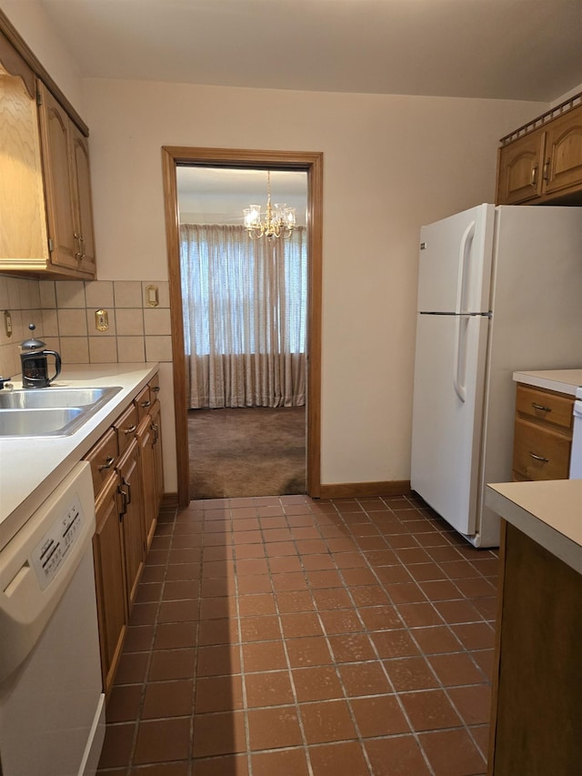 460 Westcombe Ave, Flint, MI 48503 - kitchen featuring white appliances, a sink, a chandelier, light countertops, and baseboards