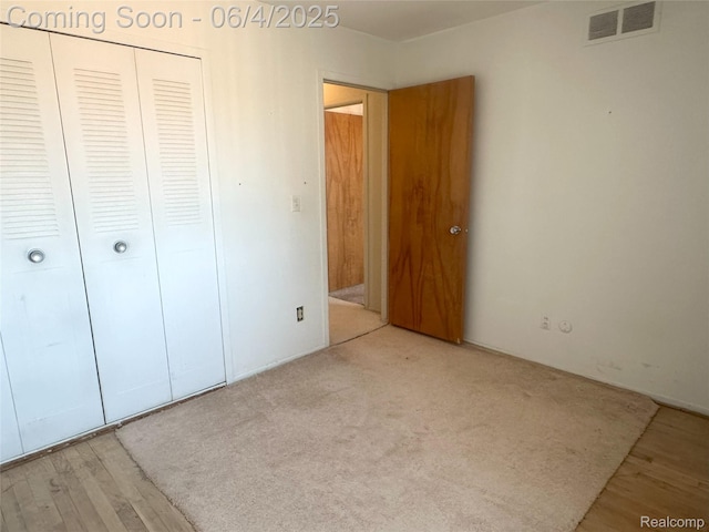 29330 Hoover Rd Unit 330, Warren, MI 48093 - unfurnished bedroom featuring a closet and wood finished floors