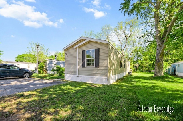 2575 Theodore Ave, Hudsonville, MI 49426 - view of home's exterior with a lawn