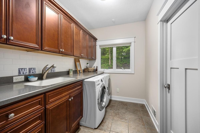 1708 N Norris Rd, Middleville, MI 49333 - washroom with cabinet space, separate washer and dryer, and baseboards