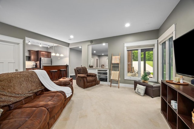 1708 N Norris Rd, Middleville, MI 49333 - living room featuring light carpet, baseboards, bar area, and recessed lighting