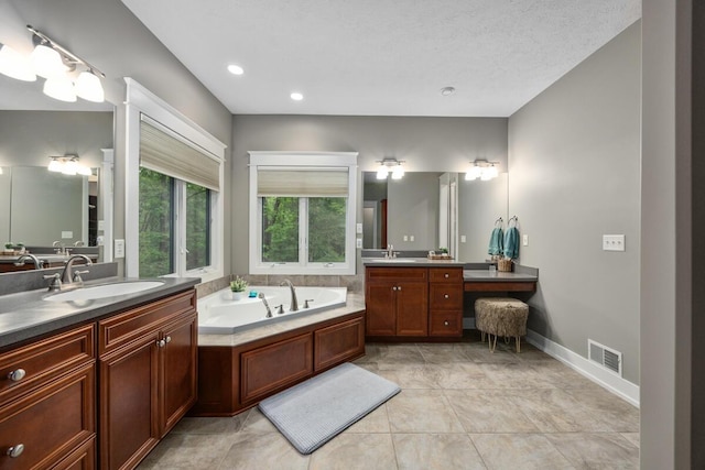 1708 N Norris Rd, Middleville, MI 49333 - full bath with two vanities, a garden tub, and baseboards