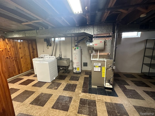 28876 Palm Beach Dr, Warren, MI 48093 - basement with gas water heater, tile patterned floors, a sink, heating unit, and separate washer and dryer