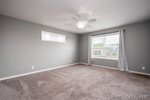 3880 Elm Ridge Dr, Holland, MI 49424 - empty room featuring ceiling fan, carpet, and baseboards
