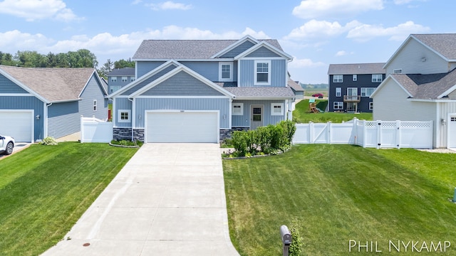 3880 Elm Ridge Dr, Holland, MI 49424 - craftsman-style house with board and batten siding, a gate, driveway, stone siding, and a garage