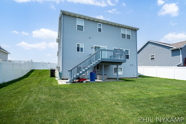 3880 Elm Ridge Dr, Holland, MI 49424 - back of house with stairs and a wooden deck
