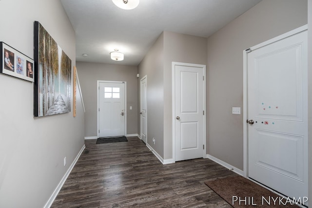 3880 Elm Ridge Dr, Holland, MI 49424 - foyer entrance with dark wood-style flooring and baseboards