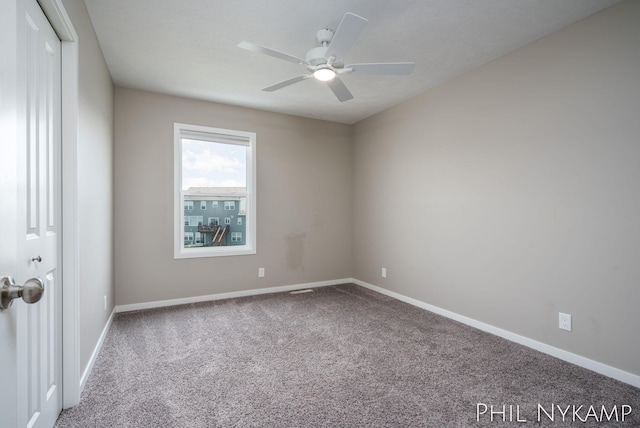 3880 Elm Ridge Dr, Holland, MI 49424 - carpeted spare room featuring a ceiling fan and baseboards