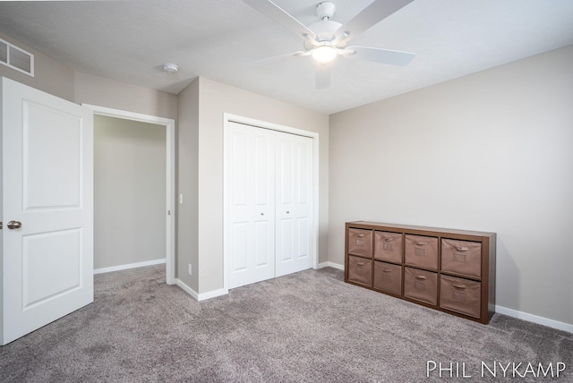 3880 Elm Ridge Dr, Holland, MI 49424 - unfurnished bedroom with carpet, a closet, and baseboards