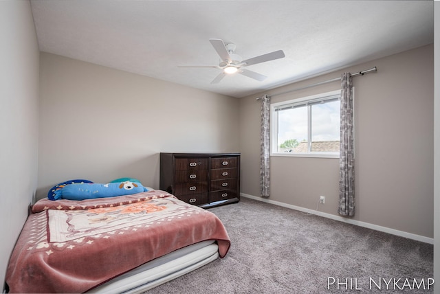 3880 Elm Ridge Dr, Holland, MI 49424 - carpeted bedroom featuring baseboards and a ceiling fan