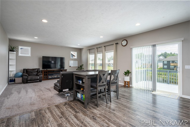 3880 Elm Ridge Dr, Holland, MI 49424 - dining area featuring wood finished floors, recessed lighting, baseboards, and a textured ceiling