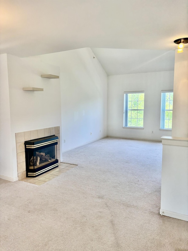 1870 Lindsay Ln, Ann Arbor, MI 48104 - unfurnished living room featuring carpet floors, a tiled fireplace, and baseboards