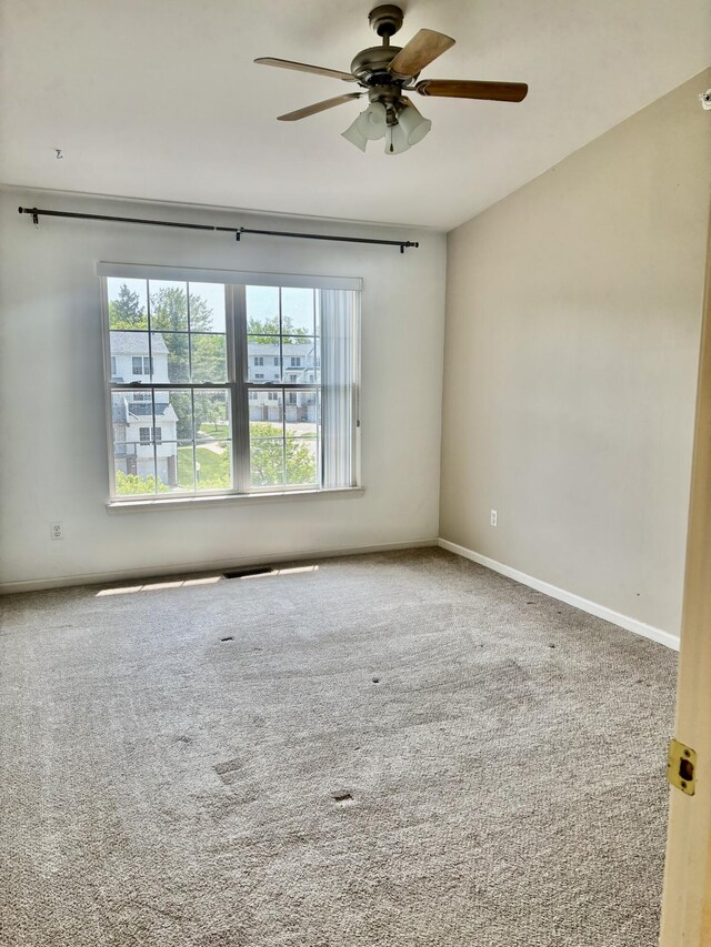 1870 Lindsay Ln, Ann Arbor, MI 48104 - empty room featuring a ceiling fan, carpet flooring, and baseboards