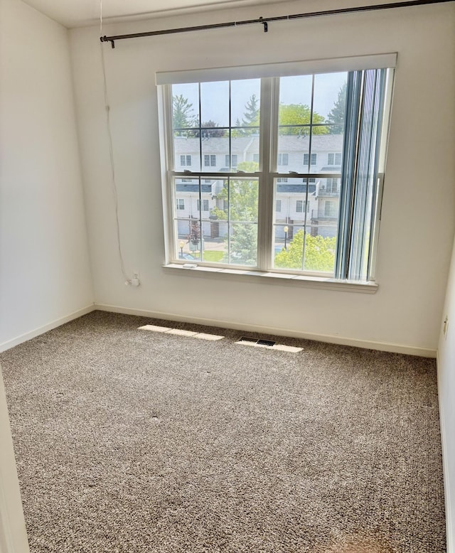 1870 Lindsay Ln, Ann Arbor, MI 48104 - spare room featuring carpet floors and baseboards