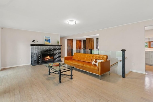 457 Gary Ave, Benton Harbor, MI 49022 - living room featuring wood finished floors, baseboards, and a tiled fireplace