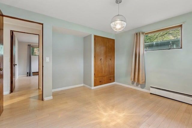 457 Gary Ave, Benton Harbor, MI 49022 - spare room featuring light wood finished floors, baseboards, and a baseboard radiator