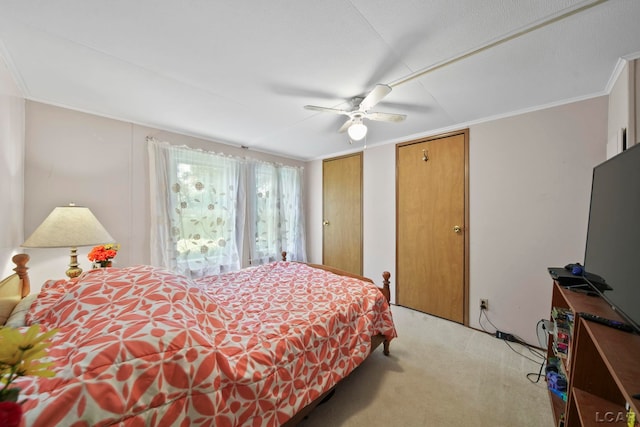 715 W Main St, Morenci, MI 49256 - bedroom featuring light colored carpet, multiple closets, ceiling fan, and ornamental molding