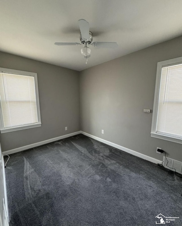 17765 Ruth St, Melvindale, MI 48122 - unfurnished room featuring dark carpet, a ceiling fan, and baseboards
