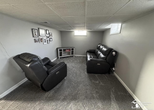 17765 Ruth St, Melvindale, MI 48122 - carpeted living area with a drop ceiling, plenty of natural light, and baseboards
