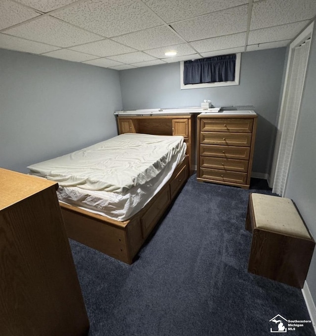 17765 Ruth St, Melvindale, MI 48122 - bedroom with dark colored carpet and a paneled ceiling