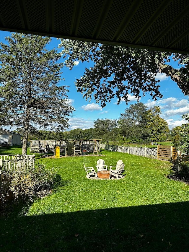 775 Riverview Dr, Plainwell, MI 49080 - view of yard featuring a fire pit