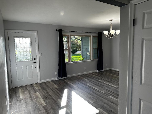 775 Riverview Dr, Plainwell, MI 49080 - foyer entrance featuring a chandelier, wood finished floors, and baseboards