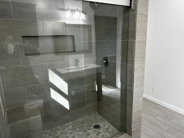 775 Riverview Dr, Plainwell, MI 49080 - full bath with a shower stall, wood finished floors, and baseboards