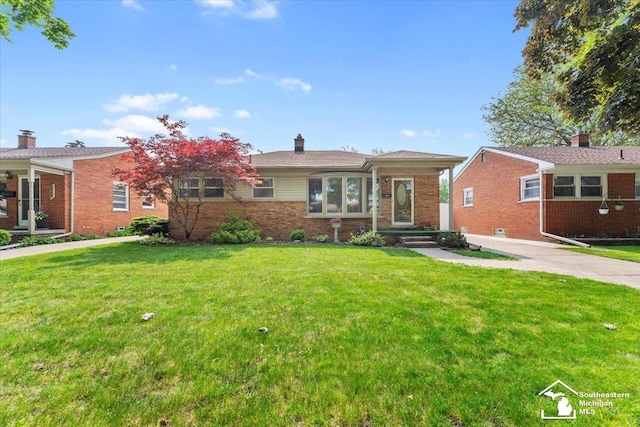 8691 Louise St, Allen Park, MI 48101 - view of front of house featuring a front yard, brick siding, and a chimney