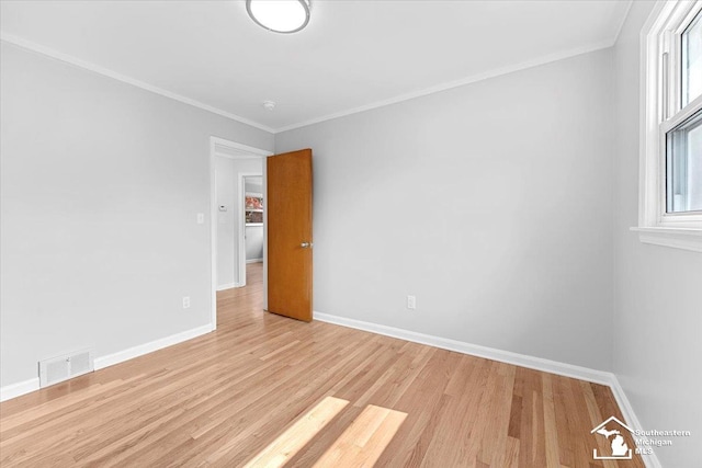 8691 Louise St, Allen Park, MI 48101 - spare room with light wood-style floors, baseboards, and crown molding