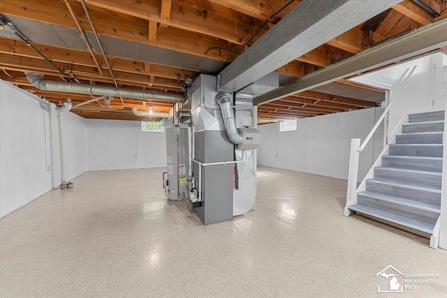 8691 Louise St, Allen Park, MI 48101 - below grade area with water heater, heating unit, and stairway