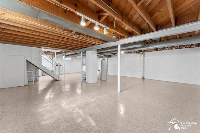 8691 Louise St, Allen Park, MI 48101 - basement with gas water heater, stairs, and washer / dryer