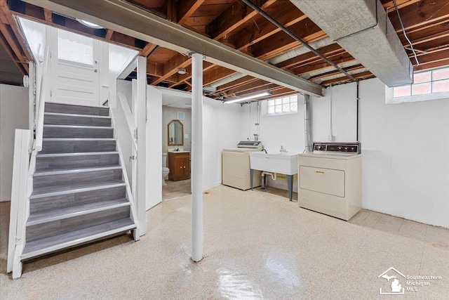 8691 Louise St, Allen Park, MI 48101 - below grade area with washer and dryer, a sink, and stairway