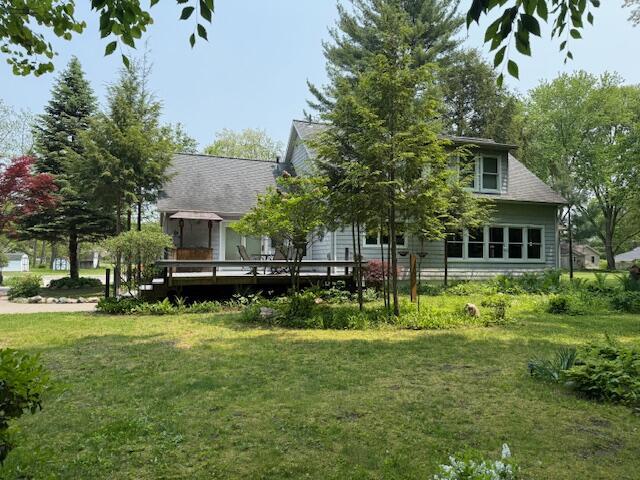 285 Scott St, Newaygo, MI 49337 - back of property with a wooden deck and a lawn