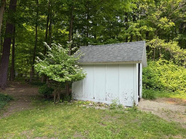 285 Scott St, Newaygo, MI 49337 - view of shed with a wooded view