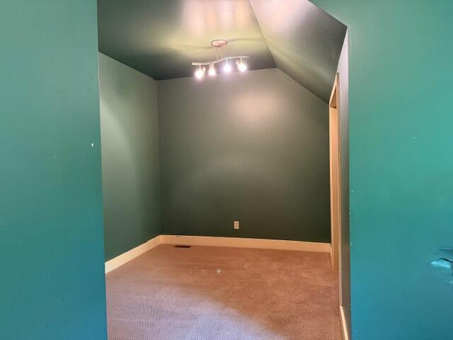 285 Scott St, Newaygo, MI 49337 - bonus room featuring carpet flooring, vaulted ceiling, and baseboards