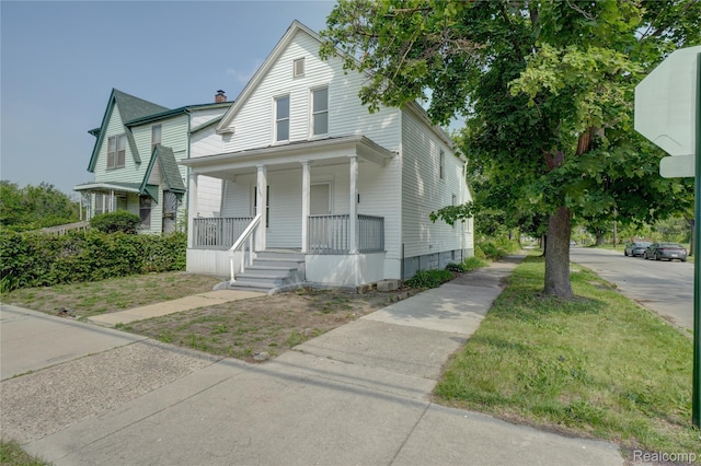 8103 E Canfield St, Detroit, MI 48214 - view of front of house featuring covered porch