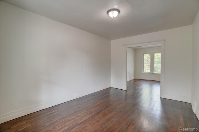 8103 E Canfield St, Detroit, MI 48214 - unfurnished room featuring dark wood-style floors and baseboards