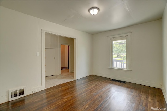 8103 E Canfield St, Detroit, MI 48214 - empty room featuring wood finished floors and baseboards