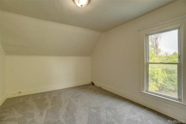8103 E Canfield St, Detroit, MI 48214 - additional living space with carpet flooring, lofted ceiling, and baseboards