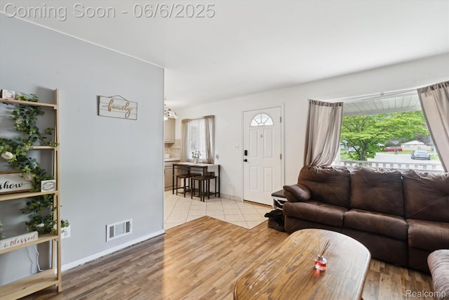6057 Sylvia St, Taylor, MI 48180 - living room with light wood-type flooring and baseboards
