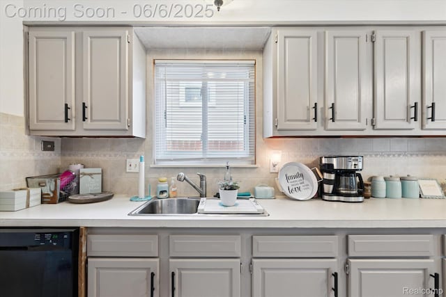 6057 Sylvia St, Taylor, MI 48180 - kitchen with black dishwasher, light countertops, decorative backsplash, and a sink