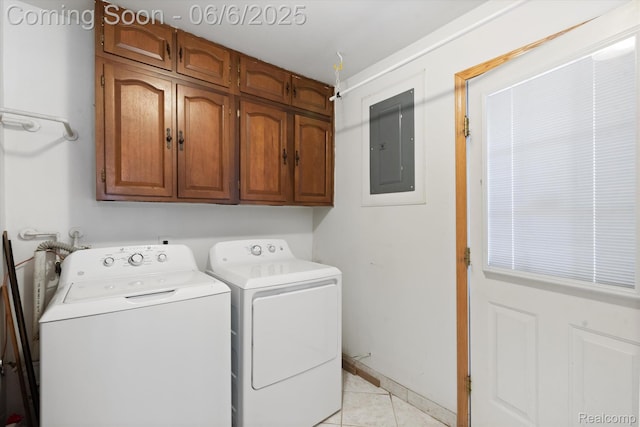 6057 Sylvia St, Taylor, MI 48180 - laundry room featuring cabinet space, electric panel, washing machine and clothes dryer, and light tile patterned floors