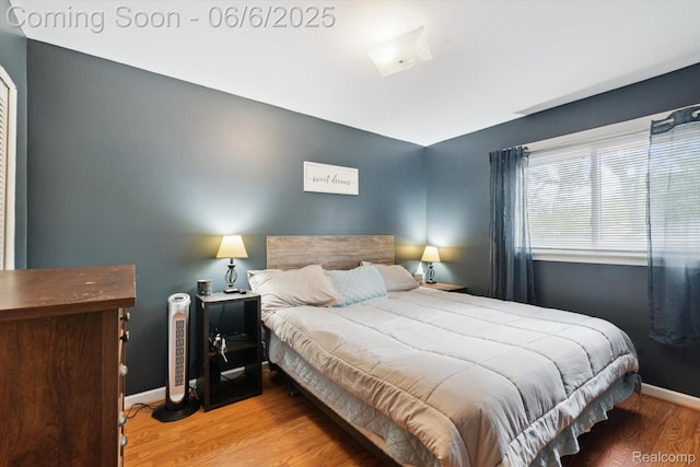 6057 Sylvia St, Taylor, MI 48180 - bedroom with wood finished floors and baseboards