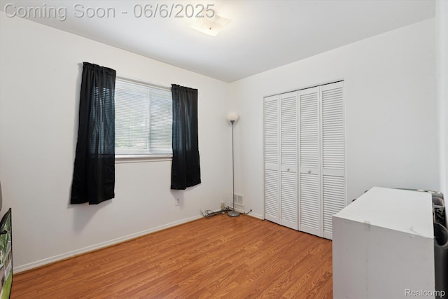 6057 Sylvia St, Taylor, MI 48180 - unfurnished bedroom featuring a closet, light wood-style flooring, and baseboards