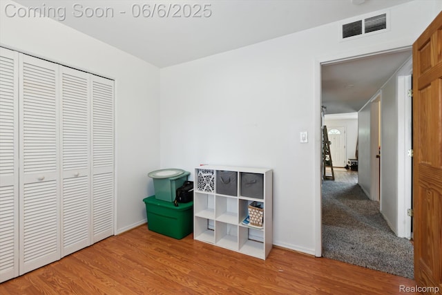6057 Sylvia St, Taylor, MI 48180 - unfurnished bedroom with wood finished floors, a closet, and baseboards